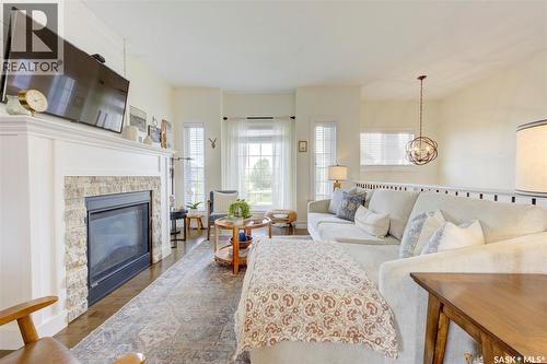 621 Braun Lane, Warman, SK - Indoor Photo Showing Living Room With Fireplace