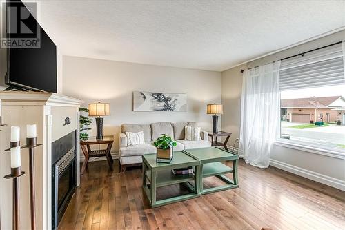33 Oak, Capreol, ON - Indoor Photo Showing Living Room With Fireplace
