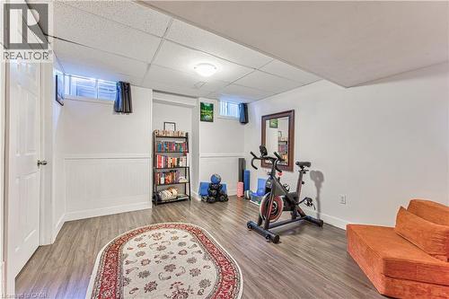 Finished lower level featuring recessed lighting and wood-finish flooring - 4057 Donnic Drive, Burlington, ON - Indoor Photo Showing Gym Room