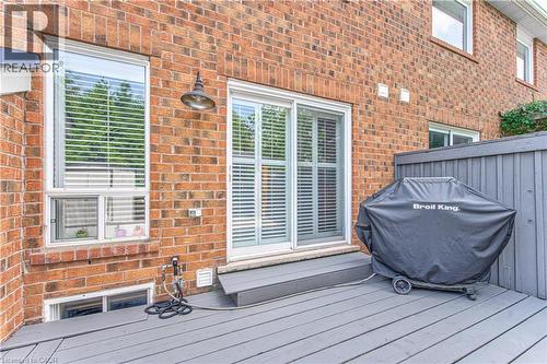 Brick exterior featuring a private deck with privacy fencing - 4057 Donnic Drive, Burlington, ON - Outdoor With Deck Patio Veranda With Exterior