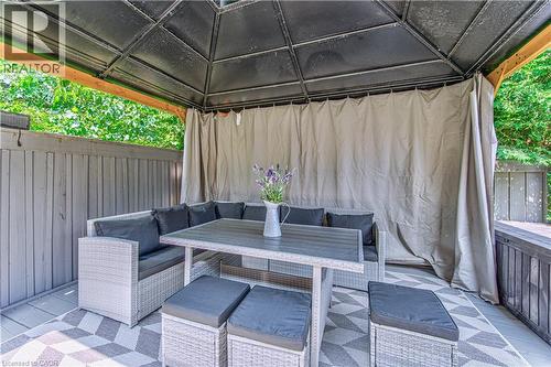 Expansive outdoor gazebo with a solid roof structure and privacy curtains - 4057 Donnic Drive, Burlington, ON - Outdoor With Deck Patio Veranda With Exterior
