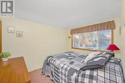 Primary Bedroom with view of water - 
