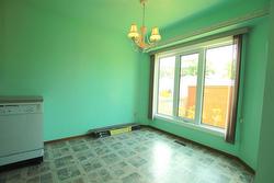 large dining area with a view to the backyard - 