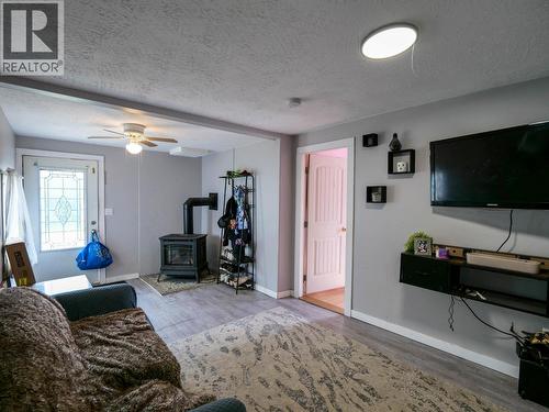 201 Lewis Drive, Quesnel, BC - Indoor Photo Showing Living Room With Fireplace