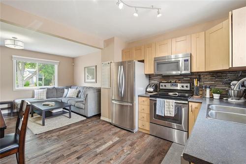 Eat-in Kitchen - 803 Day Street, Winnipeg, MB - Indoor Photo Showing Kitchen With Double Sink