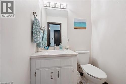 White vanity with cabinet storage, integrated sink, and a white countertop - 8 Perin Place, Kitchener, ON - Indoor Photo Showing Bathroom
