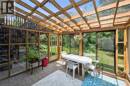 Sunroom featuring a wood-frame structure with a clear panel roof, providing ample natural light - 8 Perin Place, Kitchener, ON -  Photo Showing Other Room