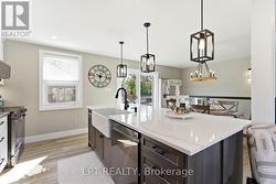 Nice sized island with built in dishwasher. - 