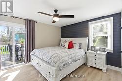 Master bedroom with entry to back sun deck. - 