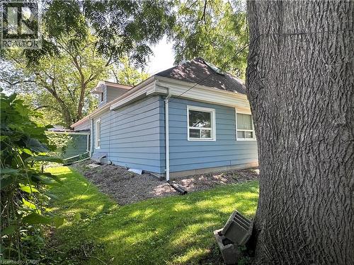Blue siding exterior with white trim and white-framed windows - 9 Norfolk Street N, Hamilton, ON - Outdoor