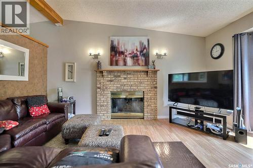 3419 Keehr Place E, Regina, SK - Indoor Photo Showing Living Room With Fireplace