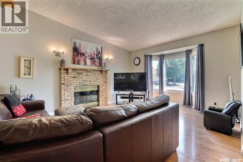 3419 Keehr Place E, Regina, SK - Indoor Photo Showing Living Room With Fireplace
