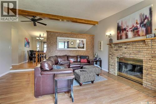 3419 Keehr Place E, Regina, SK - Indoor Photo Showing Living Room With Fireplace