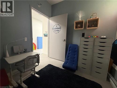 Interior room with light blue-grey walls and light-toned tile flooring - 51 Benton Street, Kitchener, ON 