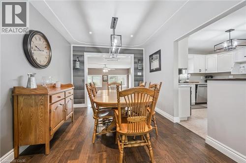 Spacious dining area featuring wood-finish flooring, recessed ceiling lighting, and a linear chandelier - 7988 Wellington Road 12, Arthur, ON - Indoor
