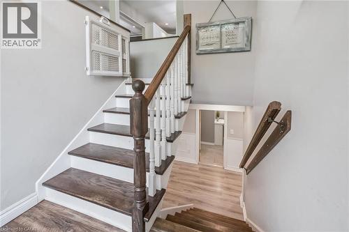Staircase featuring rich wood-finish treads and white risers - 7988 Wellington Road 12, Arthur, ON - Indoor Photo Showing Other Room