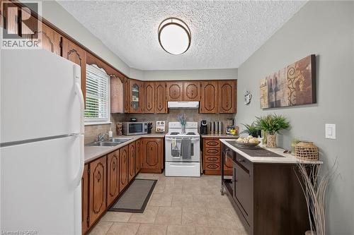 180 East 25Th Street, Hamilton, ON - Indoor Photo Showing Kitchen With Double Sink