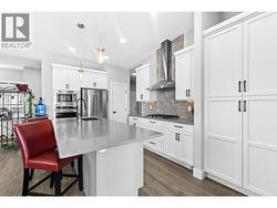 Expansive island with seating, offering the ideal gathering place for family and friends - 