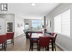 Spacious dining area perfectly positioned for entertaining family and friends. - 
