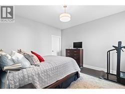 Comfortable lower level bedroom ideal for guests, family, or a home office. - 
