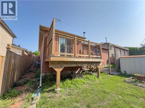 Expansive wood-finish deck with a wood railing system - 60 Attwood Drive, Cambridge, ON - Outdoor With Deck Patio Veranda
