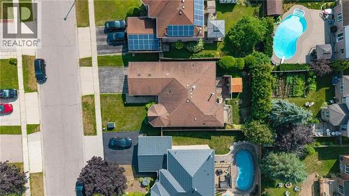 Expansive property featuring a brown shingle roof, established landscaping, and a paved driveway - 60 Attwood Drive, Cambridge, ON - Outdoor With View