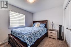 Neutral-toned room with light beige carpeting and white walls - 
