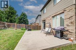 Expansive concrete patio with direct access to interior via sliding glass door - 