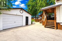 Detached garage with a single bay door and a side entry - 