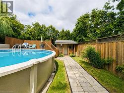 Above-ground pool with surrounding wood deck - 