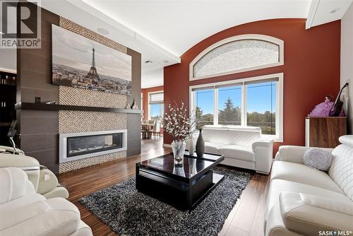 2423 Linner Bay, Regina, SK - Indoor Photo Showing Living Room With Fireplace