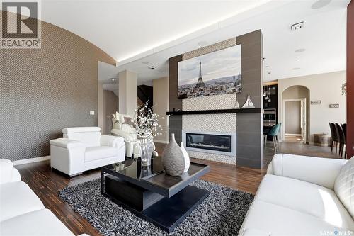 2423 Linner Bay, Regina, SK - Indoor Photo Showing Living Room With Fireplace