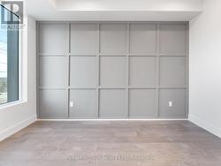 Primary bedroom - grey panel wall - 