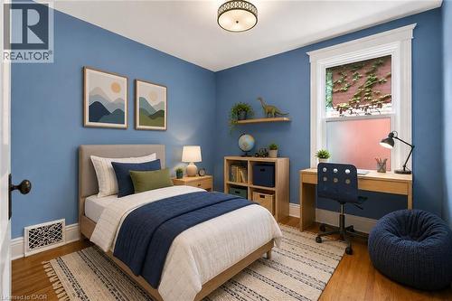 This image has been virtually staged - 520 John Street N, Hamilton, ON - Indoor Photo Showing Bedroom