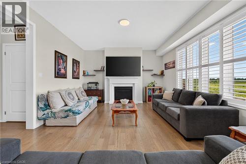76 Mcwatters Street, Binbrook, ON - Indoor Photo Showing Living Room With Fireplace