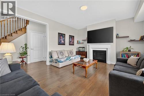 76 Mcwatters Street, Binbrook, ON - Indoor Photo Showing Living Room With Fireplace