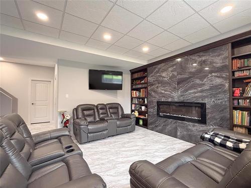 55 Outback Drive, Brandon, MB - Indoor Photo Showing Living Room With Fireplace