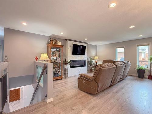 55 Outback Drive, Brandon, MB - Indoor Photo Showing Living Room With Fireplace