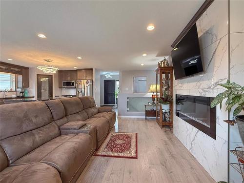 55 Outback Drive, Brandon, MB - Indoor Photo Showing Living Room With Fireplace