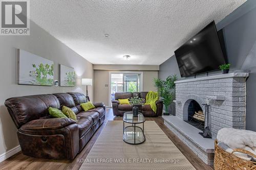 Lower Level family room - 2560 Palisander Avenue, Mississauga, ON - Indoor Photo Showing Living Room With Fireplace
