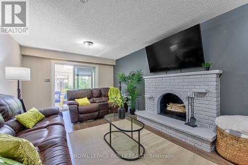 Lower Level Family Room - 2560 Palisander Avenue, Mississauga, ON - Indoor Photo Showing Living Room With Fireplace