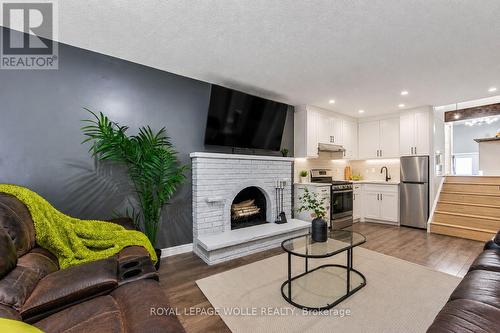 AI modified to show a kitchen - 2560 Palisander Avenue, Mississauga, ON - Indoor Photo Showing Living Room With Fireplace