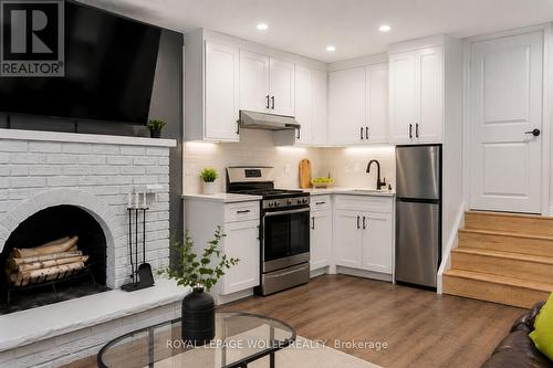 AI modified to show Kitchen - 2560 Palisander Avenue, Mississauga, ON - Indoor Photo Showing Kitchen With Fireplace