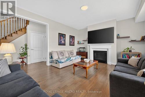 76 Mcwatters Street, Hamilton, ON - Indoor Photo Showing Living Room With Fireplace
