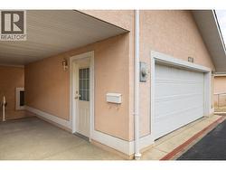 garage with steps to front door - 