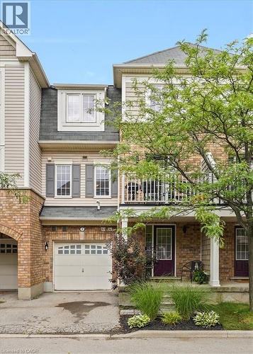 Multi-level townhome exterior featuring brick and siding finishes - 7 Sirente Drive Unit# 7, Hamilton, ON - Outdoor