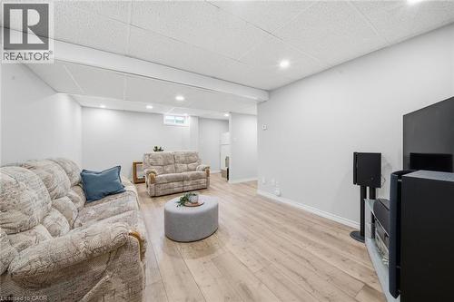 Spacious room featuring light wood-finish flooring, recessed lighting, and a white drop ceiling - 200 Morrison Drive, Caledonia, ON - Indoor Photo Showing Basement