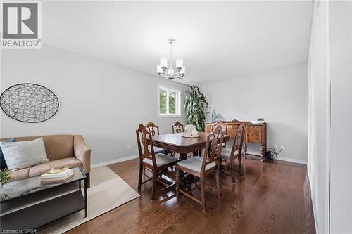 Bright interior room featuring wood-finish flooring, light grey wall paint, and a window providing natural light - 200 Morrison Drive, Caledonia, ON - Indoor Photo Showing Dining Room