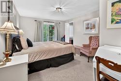 Primary bedroom with walkout, and ensuite/laundry. - 