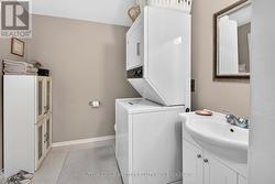 Ensuite with stackable laundry. - 